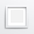 White square frame on gray wall. Royalty Free Stock Photo