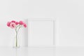 White square frame mockup with pink roses in a glass vase on a white table