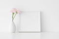 White square frame mockup with soft pink roses in a vase Royalty Free Stock Photo