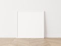 White square frame Standing on parquet floor, minimal frame mock up interior Royalty Free Stock Photo