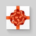 White Square Gift Box with Shiny Orange Ribbon Bow Royalty Free Stock Photo