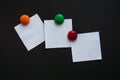 White square note stickers on a black Board. Royalty Free Stock Photo