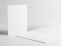 A white square object casting a shadow on a plain background Royalty Free Stock Photo