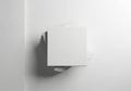 A white square object on a white wall with a shadow Royalty Free Stock Photo