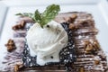 Desert Carmel covered plate walnuts almonds hot chocolate brownie with vanilla icecream and mnit leaves Royalty Free Stock Photo