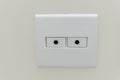 White square socket with two holes for passing coaxial or ethernet cables