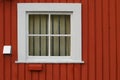 White square window set in a red wooden wall Royalty Free Stock Photo