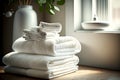 white stack white clean bath towels neatly folded on table