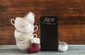 Stack cups and small blackboard on wooden table