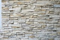 White Stacked slabs Stone wall cladding panels. Royalty Free Stock Photo