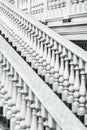 White staircase with balusters. Bright building with a beautiful staircase. Repetitive elements in architecture. Marble staircase Royalty Free Stock Photo