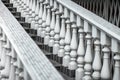White staircase with balusters. Repetitive elements in architecture. Marble staircase in the restaurant Royalty Free Stock Photo