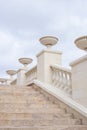 White staircase with columns leading up. Architecture and construction Royalty Free Stock Photo