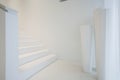 White staircase inside pure house