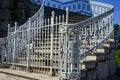 White Staircase and Ornate Metal Railing in Architectural Detail Royalty Free Stock Photo