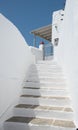 White stairs leading to a house.