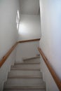 White stairs leading to the next floor. Wooden handrails Royalty Free Stock Photo