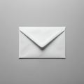 A white, standard-sized envelope rests on a plain gray background. It is sealed with the Royalty Free Stock Photo