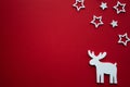 Christmas background.Reindeer and stars on red background. Royalty Free Stock Photo