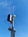 White static speed or safety camera and antenna against a blue sky. Photo radar Royalty Free Stock Photo