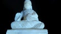 Little Buddha white statue sitting position.