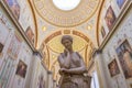 White statue inside State Hermitage Museum