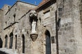 White statue of Our Lady and Child on the facade of a medieval building in the historic city of Rhodes, Greece