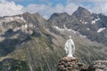 White statue of Virgin Mary, Mother of God, placed on top of the mountains. Royalty Free Stock Photo