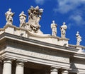 White statues on top of Vatican building, blue sky Royalty Free Stock Photo