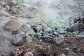 White steam raising over colored sulfur rocks, Iceland Royalty Free Stock Photo
