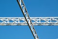 White steel cross structure on blue sky Royalty Free Stock Photo