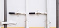 White steel door of cargo container with black handle closed for keeping asset Royalty Free Stock Photo