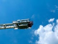 White steel truss tower crane detail of counterweight under blue sky. Royalty Free Stock Photo