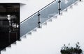 White steps with glass railing, side view. Stone staircase. Concrete steps. Concrete staircase with concrete wall Royalty Free Stock Photo