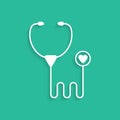 White stethoscope icon isolated on green background