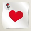 White sticky note with red heart image attached to a wall by a drawing pin. Sheet of paper with red heart. Happy Valentine`s day. Royalty Free Stock Photo