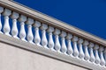 White stone balustrades over the wall.