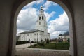 White stone bell tower in the arch of the assumption monastery, Russia Royalty Free Stock Photo