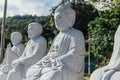 White stone carving buddha sculptures in wood structure at Kek Lok Si Temple at George Town. Panang, Malaysia Royalty Free Stock Photo