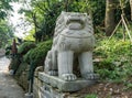 White stone Chinese guardian lion sculpture located on the walk way to Haedong Yonggungsa Temple in Busan, South Korea