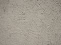 White stone concrete wall with roughness and smudges from paint, abstract background Royalty Free Stock Photo