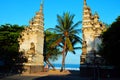 White stone door tropical paradise beach with white sand and coco palm beautiful wave Royalty Free Stock Photo