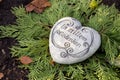 White stone heart with german text on the tomb.