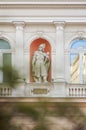 White stone or marble building with historic character or figure sculptures or statues. Arc windows, pillars and other amazing Royalty Free Stock Photo