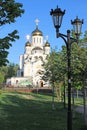 White stone Orthodox Church with Golden domes in the sun Moscow region Russia Royalty Free Stock Photo