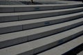 white stone staircase to an arch with backlighting of individual stair surfaces