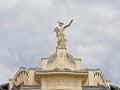 Statue of the Greek god Hermes on top of a renaissance revival building in Ljubljana, Slovenia