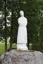 White stone statue of a holy woman on the territory of the Aglona Catholic Church in Latvia. July 2019 Royalty Free Stock Photo