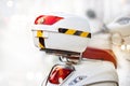 White storage box on back of motorcycle on street Royalty Free Stock Photo