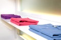 White store shelf with color clothes Royalty Free Stock Photo